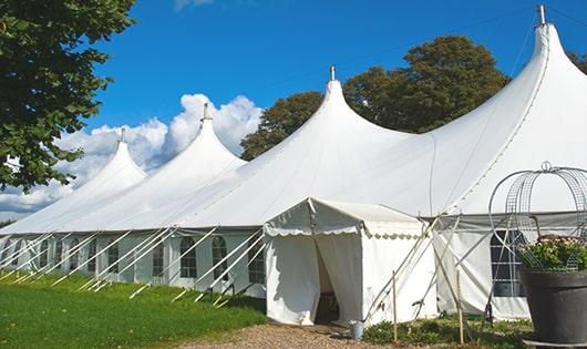 a line of sleek and modern porta potties ready for use at an upscale corporate event in Hewlett, NY